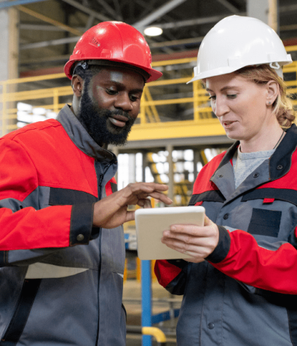 Man and woman working together in a manufacturing setting
