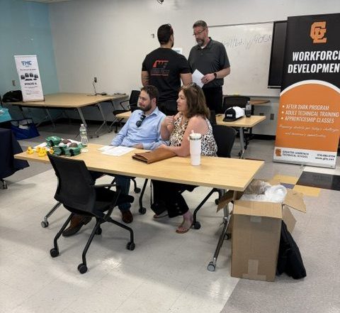 Employers at job fair at a table